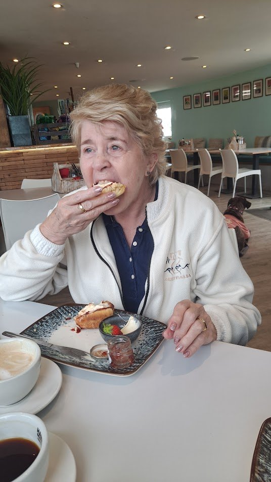 Jenni with scone, jam and cream